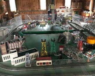 Massive 80'sf Lionel train display. (includes double  track, bridges (4), plexiglass protector and frame--- less buildings and transformer).