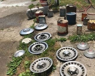 vintage hubcaps, gas cans, well hand pump