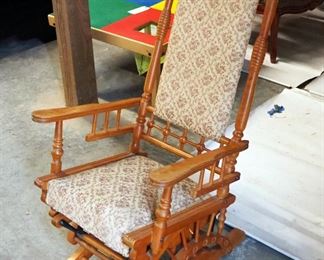 Antique Upholstered Spindle Rocker On Casters, 46" x 23.5" x 31"