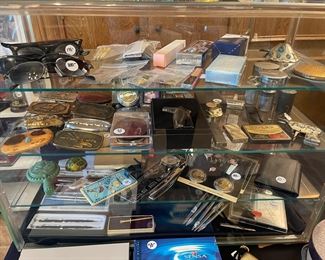 Glasses, Lighters, Pens, Compacts, Pocket Knives, Buckles, Watches, Coins, Makeup and more!