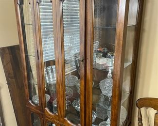 Pecan curio / two pc cabinet.