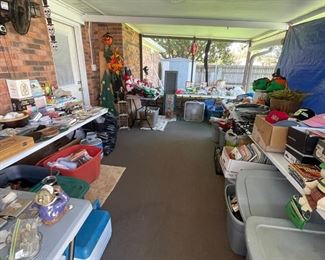 Screened porch full of a little bit of everything that we couldn't fit in the house!!