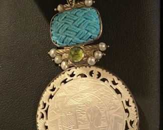 Large carved turquoise and mother of pearl of coin with peridot and pearls 