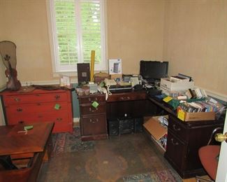 painted antique chest, coffee table, L desk, office misc, cds, phones, violin, wall gun