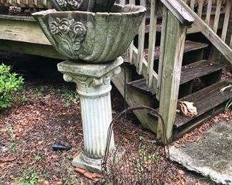 large fountain and wire basket planter