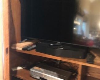 flat screen tv, sound bar, dvd/vcr, vintage bose speakers
