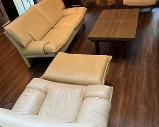 White leather Mid-center modern (MCM) couch, chair and ottoman.