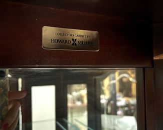 Glass curio cabinet by Howard Miller