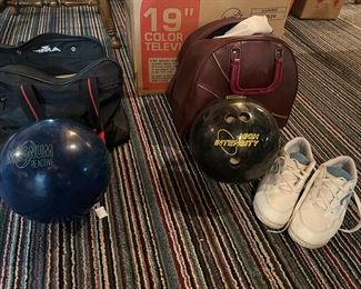 Bowling balls, each with case. One pair of women's bowling shoes
