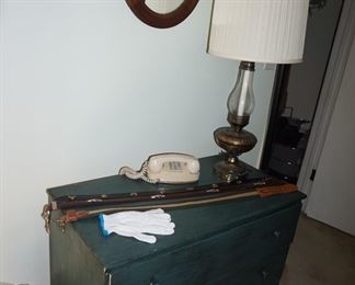 small chest, men's belts, gloves, vintage phone, lamp, mirror