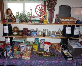 Doll, spinning wheel, tins, decor
