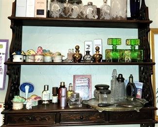 Carved wood plate rack with perfume bottles, perfumes and vanity sets