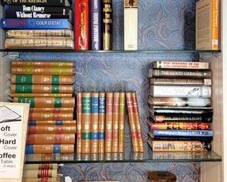 Leather bound books: law and "greatest of all time". Golf and attorney figurines