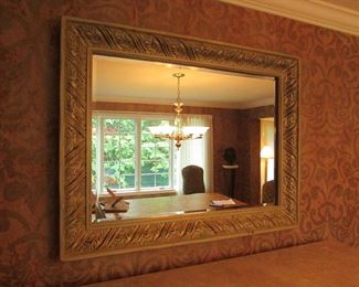 Item 6: Ornate beveled mirror with painted wooden and resin frame. Stamped “Made in USA” to back. Has hooks on back to hang either way. 49” long x 38” tall. Frame is 2.75” thick. PRICE: $250.00