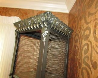 Item 8: Ornate metal and glass étagère (with wooden bottom panel). Has three glass shelves. 77” tall x 16” deep x 17.5” at widest points. PRICE: $650.00