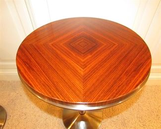 Item 13: Contemporary wooden and metal accent table with brushed nickel finish to metal. Brand name not found. 2’ tall x 18.5” diameter. PRICE: $195.00