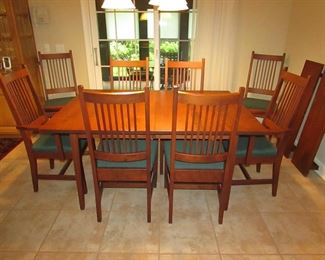 Item 15: L. & Sons Woodshop of Apple Creek, Ohio cherry Mission-style dining table with (8) chairs. (six side chairs and two arm chairs). Also with (2) leaves that are each 1’ wide. Table without leaves is 5’ long x 42” wide x 30” tall. PRICE: $1,200.00