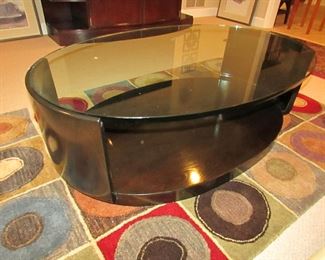 Item 19: McGuire of San Francisco contemporary and wooden glass top cocktail table. (Glass is .75” thick). 48.5” long x 31.5” wide x 15.25” tall. PRICE: $450.00