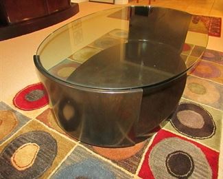 Item 19: McGuire of San Francisco contemporary and wooden glass top cocktail table. (Glass is .75” thick). 48.5” long x 31.5” wide x 15.25” tall. PRICE: $450.00