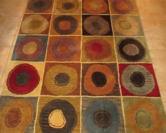 Item 20: Contemporary Crate and Barrel “Sebastian” wool and cotton blend area rug with pad. Measures 6’ x 4’. PRICE: $150.00