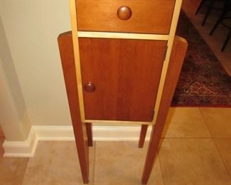 Item 21: Ethan Allen Wheat Forest Cranberry Storkie Cabinet with drawer. Wear to finish on top. 42” tall x 16” wide x 12” deep. PRICE: $195.00