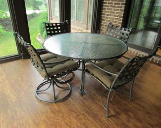 Item 22: Brown-Jordan round glass top patio table with (4) chairs. (Two chairs swivel and two are regular). All chairs have cushions. Table is 49.5” diameter and 28.5” tall. Chairs measure 22” wide x 36.5” tall. PRICE: $650.00
