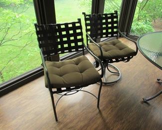 Item 22: Brown-Jordan round glass top patio table with (4) chairs. (Two chairs swivel and two are regular). All chairs have cushions. Table is 49.5” diameter and 28.5” tall. Chairs measure 22” wide x 36.5” tall. PRICE: $650.00