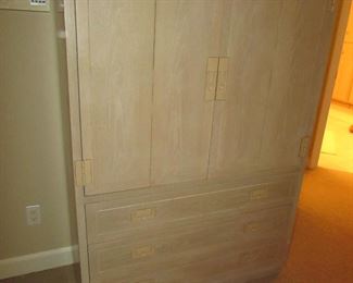 Item 25: Henredon campaign style blonde oak wardrobe cabinet. 43” wide x 62” tall x 18” deep. PRICE: $495.00
