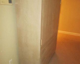 Item 25: Henredon campaign style blonde oak wardrobe cabinet. 43” wide x 62” tall x 18” deep. PRICE: $495.00