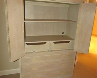 Item 25: Henredon campaign style blonde oak wardrobe cabinet. 43” wide x 62” tall x 18” deep. PRICE: $495.00
