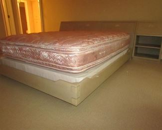 Item 26: Henredon queen bed with (2) matching night stands that fit against the sides of the headboard. Storage inside the headboard. Headboard alone measures 64” wide x 18” deep x 34” tall. Each flush fitting night stand measures 22” wide. Overall length of headboard with nightstands is 9’. PRICE: $750.00