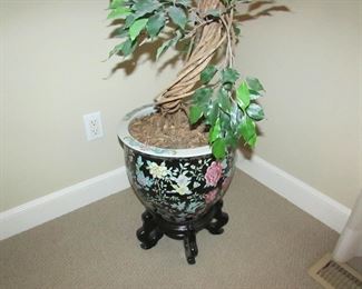 Item 28: Faux potted tree in Asian-style ceramic fishbowl planter with wooden stand. Overall height is approximately 78” and 22” at widest point. Fishbowl planter measures 15” in diameter. PRICE: $195.00