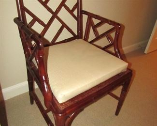 Item 29: Wooden bamboo-style arm chair with caned seat and removable custom cushion. No makers mark. 23” wide x 36” tall x 19.5” deep. PRICE: $150.00