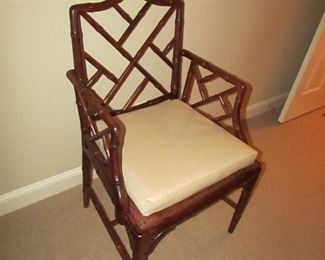 Item 30: Another Wooden bamboo-style arm chair with caned seat and removable custom cushion. No makers mark. 23” wide x 36” tall x 19.5” deep. PRICE: $150.00