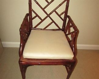 Item 30: Another Wooden bamboo-style arm chair with caned seat and removable custom cushion. No makers mark. 23” wide x 36” tall x 19.5” deep. PRICE: $150.00