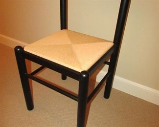 Item 32: Black painted side chair with woven seat. No makers mark found. Measures 32” tall x 17” wide x 16” deep. PRICE: $125.00