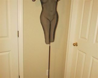 Item 39: Randy Cooper original signed mesh wire sculpture. “Kimberleigh.” On stand. 61” tall (with stand) x 16” wide (at widest point). Body of sculpture measures 34” tall (without stand). PRICE: $750.00