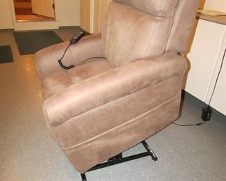 Item 57: Viva Lift upholstered power lifting recliner. Purchased in 2018 and very lightly used. 33” wide a 40.5” tall x 41” deep. PRICE: $595.00
