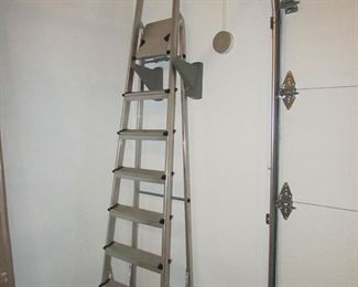 Item 61: LeifHeit (Made in Germany) lightweight aluminum 7-step step ladder. Measures 103” long. PRICE: $125.00