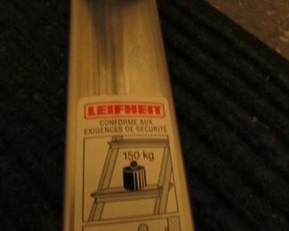 Item 61: LeifHeit (Made in Germany) lightweight aluminum 7-step step ladder. Measures 103” long. PRICE: $125.00