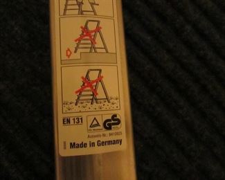 Item 61: LeifHeit (Made in Germany) lightweight aluminum 7-step step ladder. Measures 103” long. PRICE: $125.00