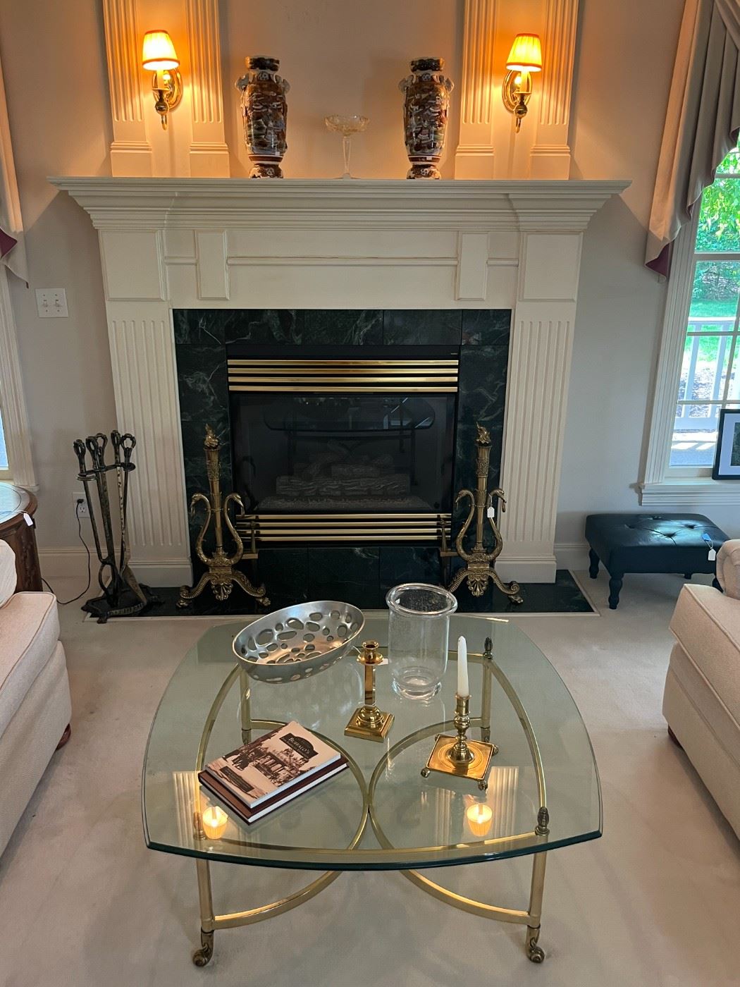Contemporary glass top and brass coffee table