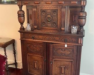 Antique walnut breakfront from the nine piece dining room set