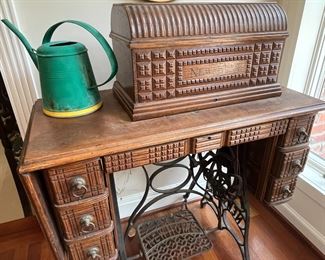 an antique Newhome oak sewing cabinet