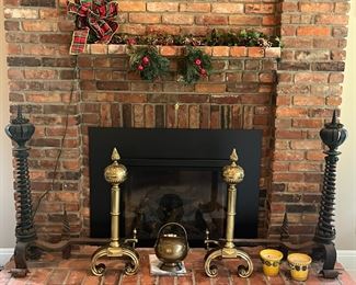 two of the three pairs of monumental brass and wrought iron andiron sets from the Hayes mansion in Buffalo, N.Y.