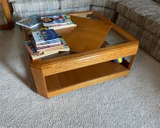 . . . an oak trimmed glass top coffee table