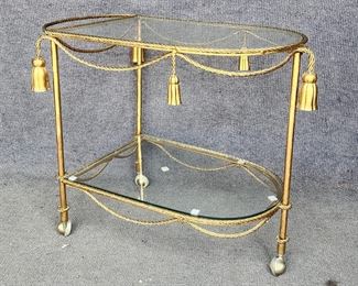 Vintage Italian 1960's Hollywood Regency Style Gold Gilt Metal 2 Tier Tea Caddy Cart with decorative Tope and Tassel accents

