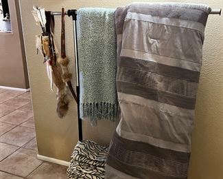 Antique native American bow and arrow. Blankets.