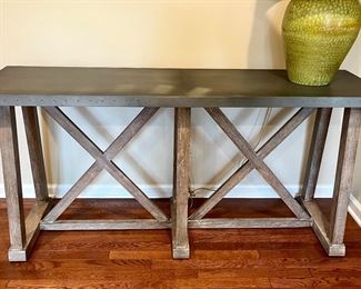 Ethan Allen Bruckner Metal-Top Console Table. 60.5" W x 18" D x 30"H.  Currently on Ethan Allen Web Site at $1970.00.  Crafted in Solid Rubberwood Frame and Zinc top with Brass Nail Heads for Industrial Look.