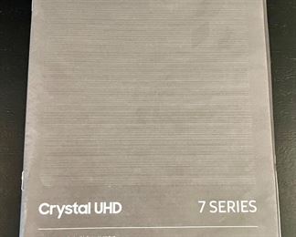 65" Samsung Crystal UHD 7 Series HDTV, Smart and WiFi with Stand, Remote Control and Manual.  Works great and excellent picture.